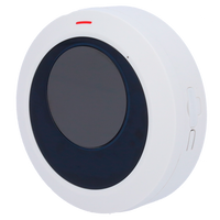 Round white and black wireless security sensor with red indicator light