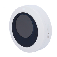 round white motion sensor detector with black center and red indicator for security system