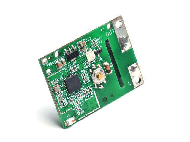 Green electronic circuit board with microchips, connectors, and labeled 5V DC input