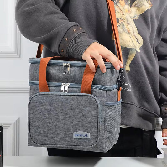BRIVILAS double-layer insulated lunch cooler bag in grey being carried by shoulder strap