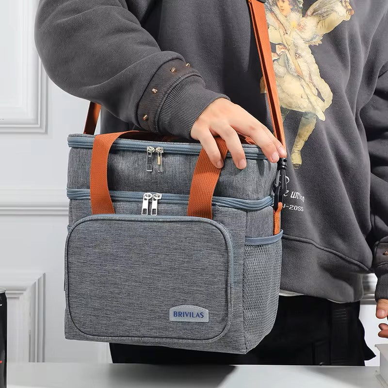 BRIVILAS double-layer insulated lunch cooler bag in grey being carried by shoulder strap