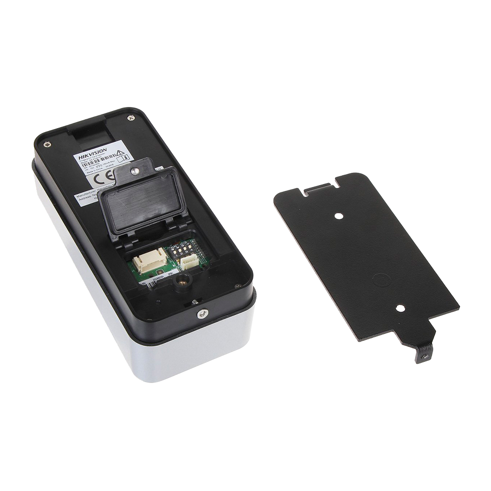 Security device back panel open showing circuit board and detached cover plate