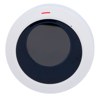 Round white and black wireless security alarm sensor with red indicator light