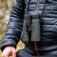 Hawke Nature-Trek 8x32 green binoculars worn with neck strap outdoors