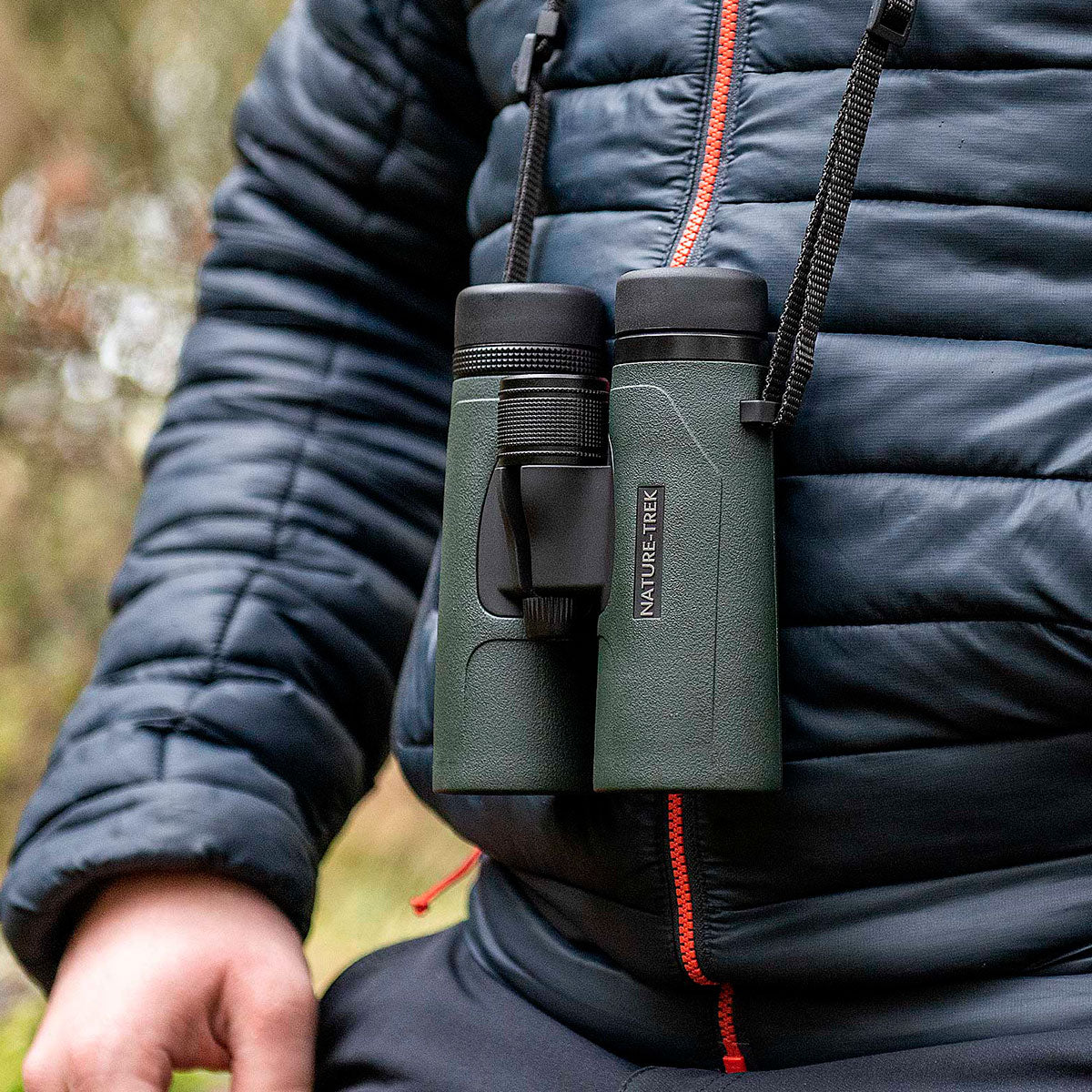 Hawke Nature-Trek 8x32 green binoculars worn with neck strap outdoors