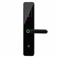 Black electronic door lock with keypad and green illuminated handle, smart security device