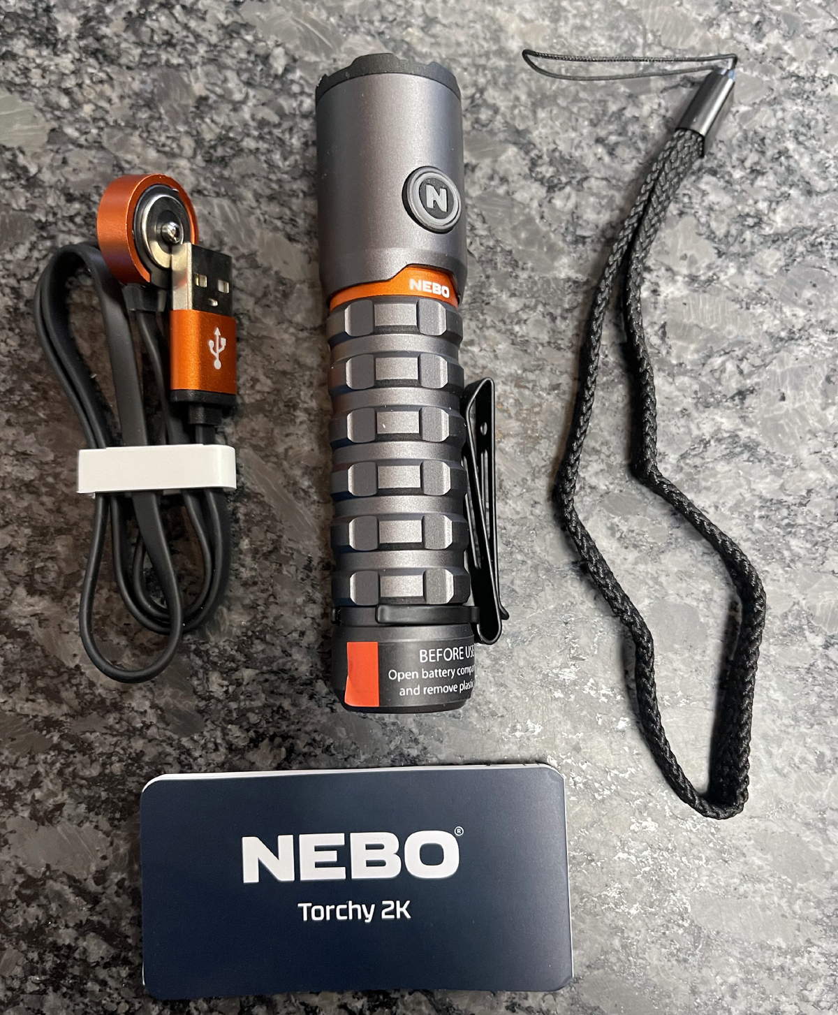 NEBO Torchy 2K flashlight with MagDock charging cable and accessories