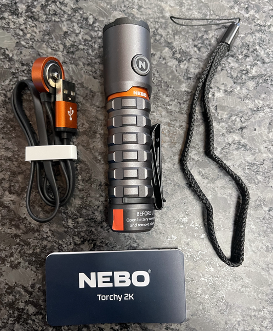 NEBO Torchy 2K flashlight with MagDock charging cable and accessories
