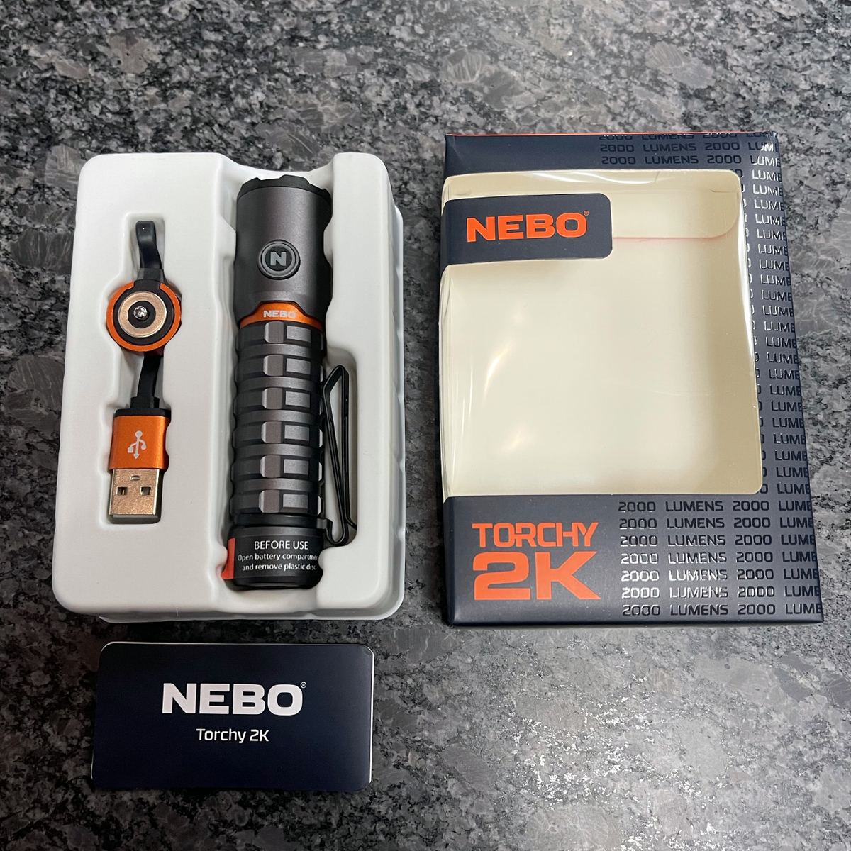 NEBO Torchy 2K flashlight with MagDock USB charging cable and box contents