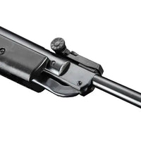 Close-up of black air rifle barrel and rear sight on white background