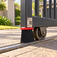The Cleaner gate brush fitted in front of a sliding gate wheel on a driveway
